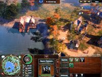 Screenshot of buildings and foot soldiers near a bay in AoE3